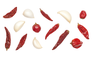 Variety of dried chilies and garlic cloves arranged creatively on a white background, perfect for culinary themes.