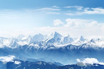 Obraz premium A panoramic view of a majestic mountain range with snow-capped peaks under a clear blue sky