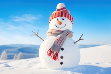Obraz premium A smiling snowman with a colorful woolen hat and mittens, standing on a snow-covered hill with a clear blue sky