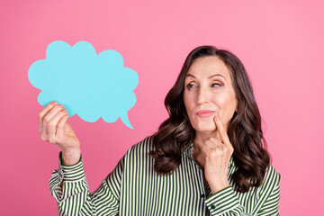 Portrait of pretty aged lady look empty space mind bubble wear striped shirt isolated on pink color...