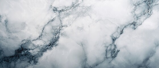 Smooth marble surface with elegant veining and polished shine, creating a sophisticated and timeless background with intricate details