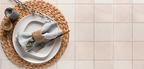 Beautiful table setting with eucalyptus and willow branches on white tile background