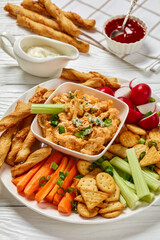 buffalo chicken dip with veggie and bread sticks