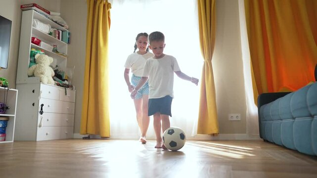 Children play sunny room. Joyful siblings enjoy indoor activities. family time as children play. Family bonding through playtime. Children play creating joyful family moments. Family joy children play