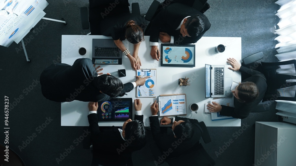 Aufkleber top down aerial view of business people discussing about financial strategy on table with document a