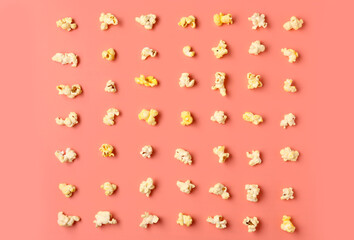 Crispy popcorn on pink background