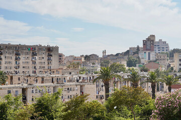 Families live in very close proximity in this residential area of Algiers, landscaped with palm trees in the vicinity of the Monument to Martyrs.