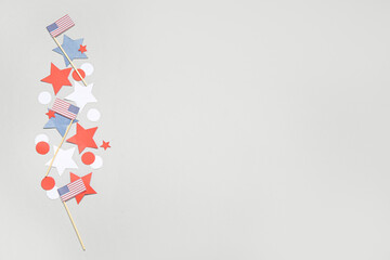 USA flags and stars on grey background. Independence Day celebration