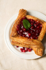 A delicious dessertwith berry filling. Cranberry dessert on a light color