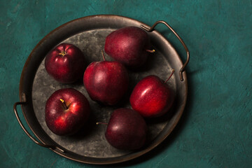 Beautiful juicy red apples in a tray