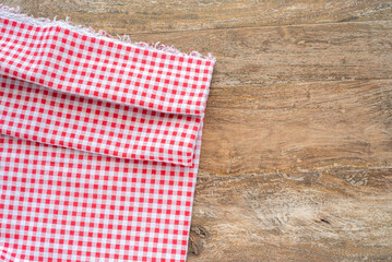 Obraz premium Part of tablecloth over wooden surface.