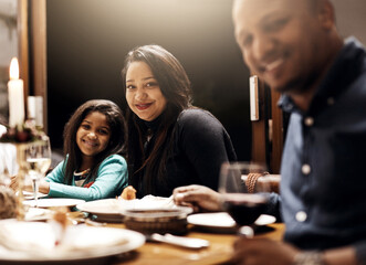 Lunch, portrait and smile of family at dining room table of home together for celebration event. Christmas, festive or thanksgiving with happy mother, father and daughter in apartment for bonding