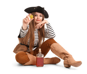 Beautiful female pirate with bottle of rum and golden coin on white background