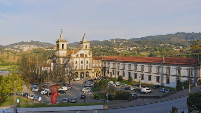 Stunning 4k drone footage of a Portugal city - Santo Tirso. View of the Abade Pedrosa Municipal Museum and the Monastery of St. Benedict (Sao Bento) with the Ave River in the background.