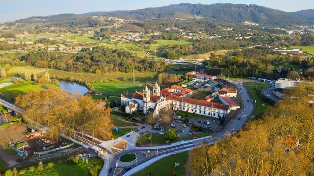 Stunning 4k drone footage of a Portugal city - Santo Tirso. View of the Abade Pedrosa Municipal Museum and the Monastery of St. Benedict (Sao Bento) with the Ave River in the background.