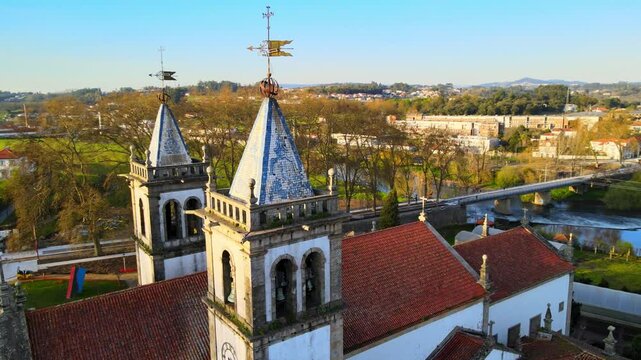 Stunning 4k drone footage of a Portugal city - Santo Tirso. View of the Abade Pedrosa Municipal Museum and the Monastery of St. Benedict (Sao Bento) with the Ave River in the background.