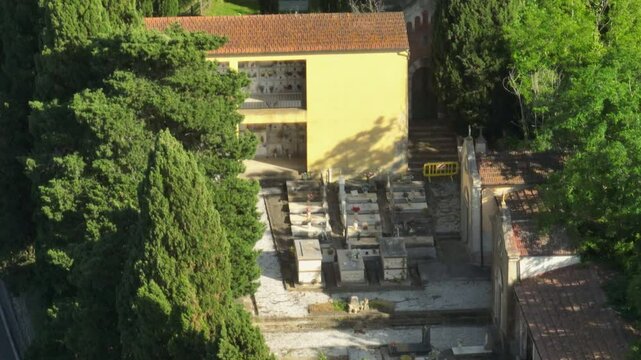 Graveyard Of Cimitero di Lorenzana In Crespina Lorenzana, Pisa, Tuscany, Italy. Aerial Drone Shot
