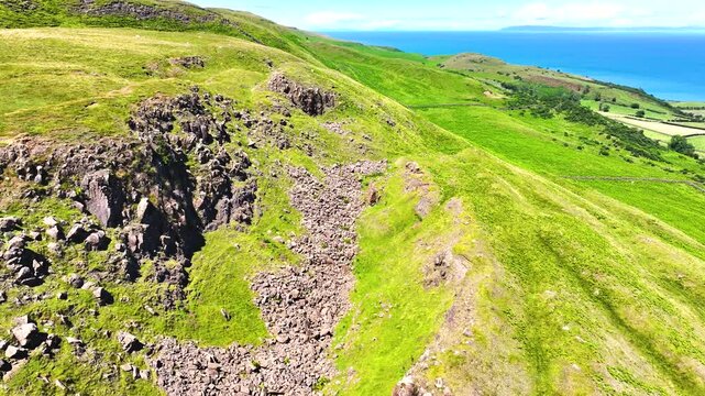 Drone Aerial view of the Beautiful Rolling hills of the coast of Ireland