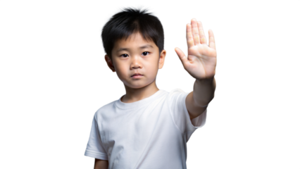 Young Boy Holds Up Hand In Stop Gesture
