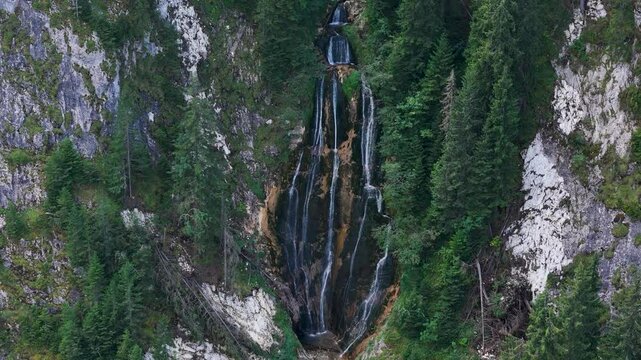 Top-down view over Cascada Cailor Waterfall surrounded by lush green vegetation in the Rodnei Mountains, Borsa, Bucovina region, Romania