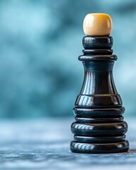 A stack of gold and silver coins against a bokeh background.
