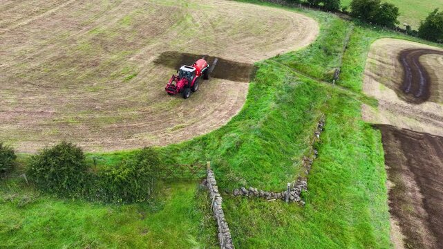 Massey Ferguson 4255 tractor and front loader with an Abbey manure slurry spreader with front loader sowing Artificial Manure fertilizer on a farm in Ireland 22-08-24