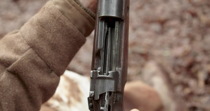 Close Up of Hands cocking rifle gun to reveal empty chamber, World War 2, Static Shot