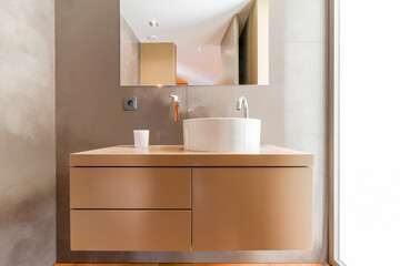 Interior photo of the modern stylish bathroom in beige colors