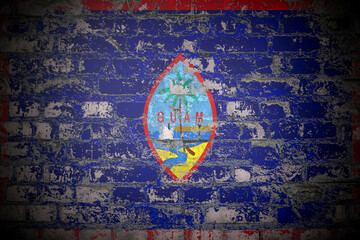Obraz premium Flag of Guam on brick wall