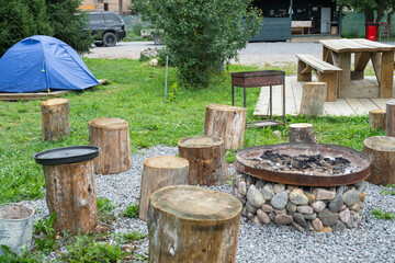 Installed tourist tent in a camping in nature in the forest. Domestic tourism, active summer holidays, family adventures. Ecotourism, sport, hike. Copy space, mock up