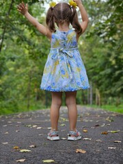 little girl walking in the park