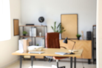 Blurred view of modern office with workplace