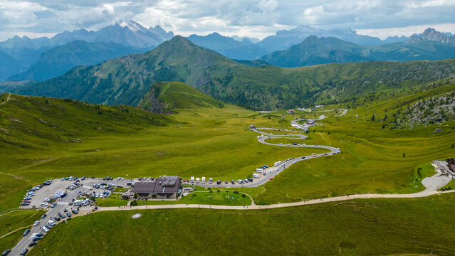 An aerial view of Passo di Giau and Ra Gusela in the Dolomites, Italy, captured by a drone. This stunning mountain pass and the striking peak of Ra Gusela offer breathtaking panoramic views