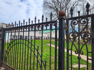 Decorative forged fence, railings in old stiletto. Isolated over white background.