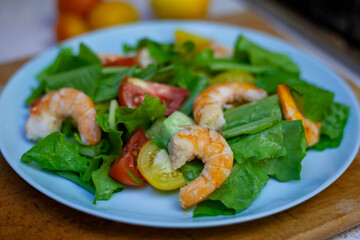 Salad with shrimp with cherry, lemon and vegetables. Healthy food. Homemade simple recipe