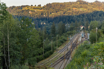 Passengers were late for the train which left on the rails over the bridge towards the mountains