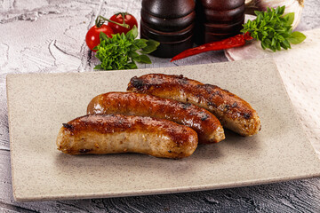 Delicous natural roasted sausages in the plate