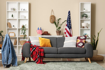 USA flags, sofa and racks in interior of living room