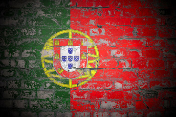 Fototapeta premium Flag of Portugal on brick wall
