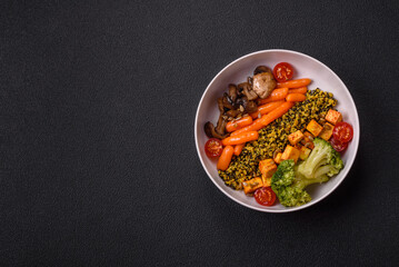 Colorful vegan vegetarian dish consists of tofu, broccoli, quinoa, mushrooms