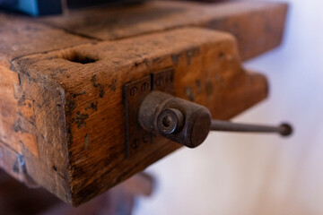 Morza in the foreground on an old carpenter's table. Craftsmanship.