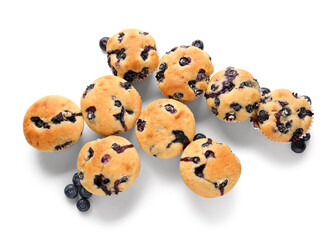 Tasty blueberry muffins on white background