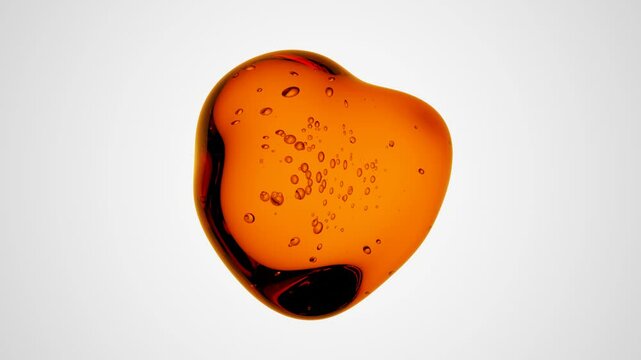 Clear liquid orange drop with little air bubbles inside on a white  background. Abstract 3d Animation for Science and Cosmetics Motion Design