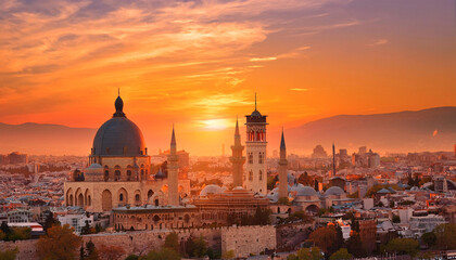 Obraz premium Sunset over historic cityscape with domed structures