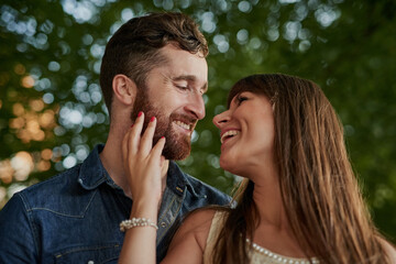 Date, smile and couple laughing outdoor for love, romance or healthy relationship together. Vacation, happy man and woman in nature for funny conversation, connection or loyalty to partner on holiday