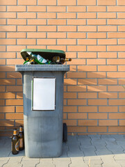 Overflowing Trash Bin with Glass Bottles