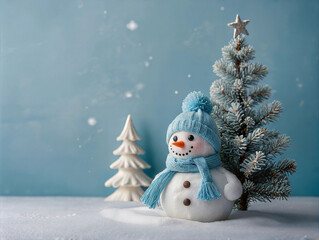 Obraz premium Smiling Snowman with Blue Scarf and Hat Next to Frosted Christmas Tree on Snowy Background