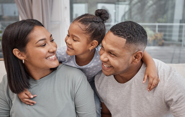 Obraz premium Hug, love or smile with family on sofa in living room of home together for bonding or support. Funny, happy or laughing with daughter, father and mother in apartment lounge for comedy or security