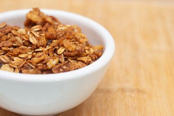 white bowl full of granola.