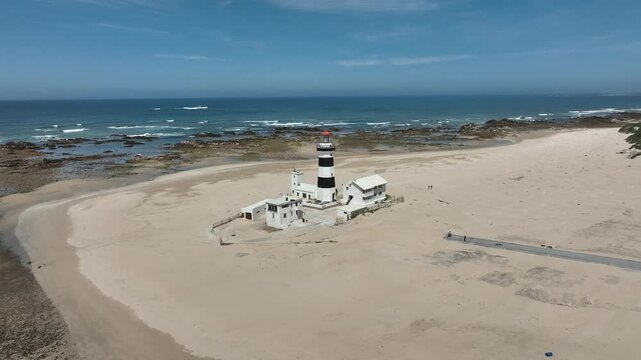 Aerial view of the beautiful Cape Receife with its iconic lighthouse and serene beach along the coastline, Port Elizabeth, South Africa.